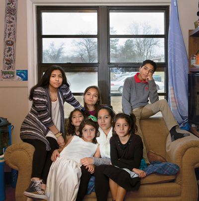 Indira Islas (center) with her siblings during her return home to Georgia for the Christmas break. - Photo by Angela Strassheim for The New York Times